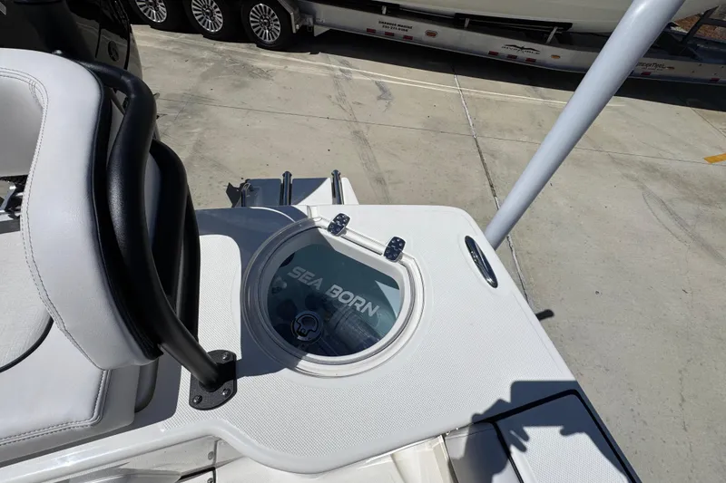 Slide: The Image of 2026 Sea Born FX25 Bay boat deck with seating and storage compartment. - 43
