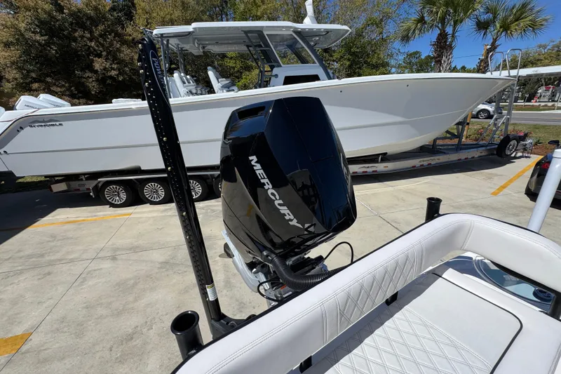 Slide: The Image of 2026 Sea Born FX25 Bay boat with Mercury engine on display outdoors. - 45