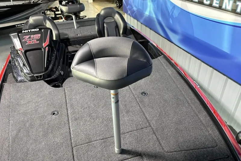 Slide: The Image of 2026 Nitro Z19 XL Pro boat interior with pedestal seat and carpeted deck. - 11