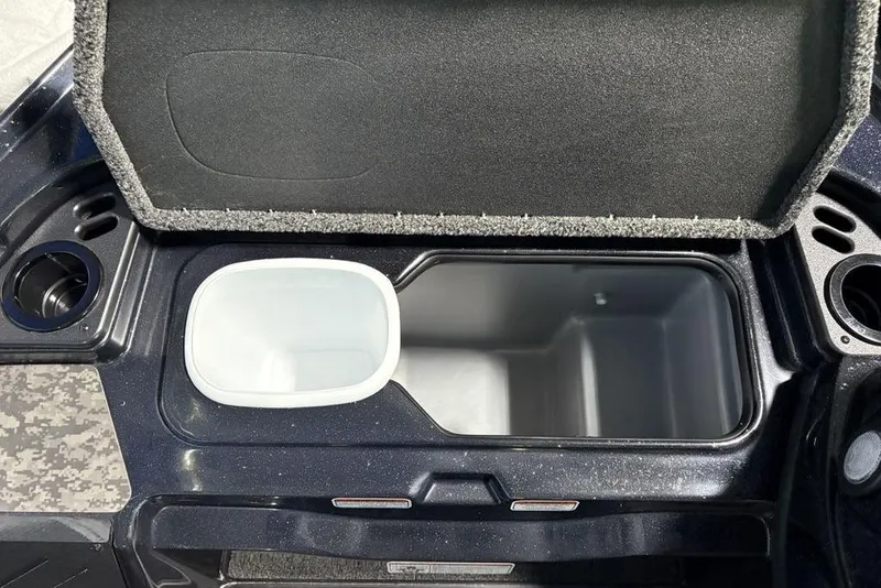 Slide: The Image of Open storage compartment in 2026 Nitro Z19 XL Pro boat, featuring cup holders and sleek design. - 14