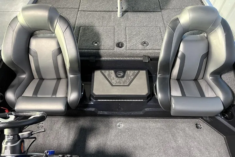 Slide: The Image of 2026 Nitro Z19 XL Pro boat interior with dual gray seats and carpeted flooring. - 18