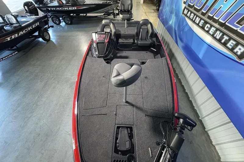 Slide: The Image of 2026 Nitro Z19 XL Pro boat interior at dealership, featuring seating and fishing equipment. - 31