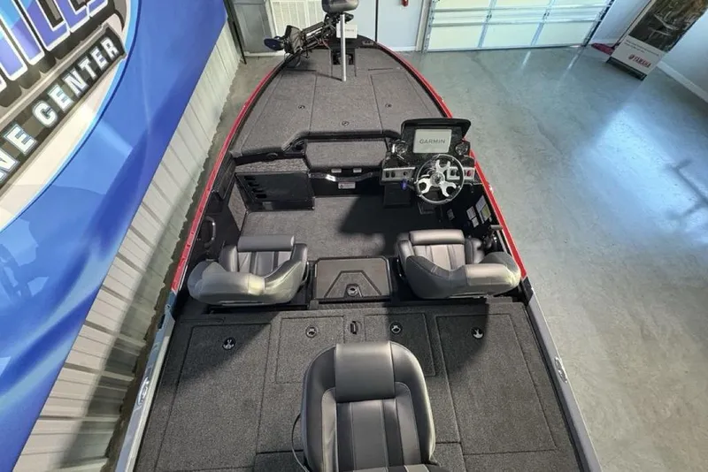 Slide: The Image of 2026 Nitro Z19 XL Pro boat interior with steering wheel and seating in showroom. - 33