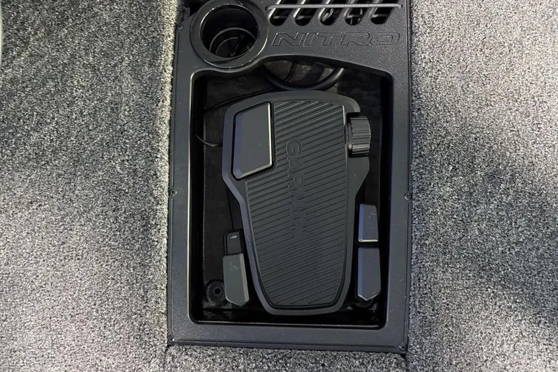 Slide: The Image of 2026 Nitro Z19 XL Pro boat pedal with Garmin branding in a carpeted compartment. - 4