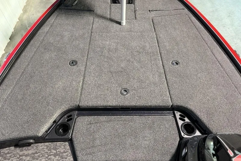 Slide: The Image of 2026 Nitro Z19 XL Pro boat deck with gray carpet and storage compartments. - 9