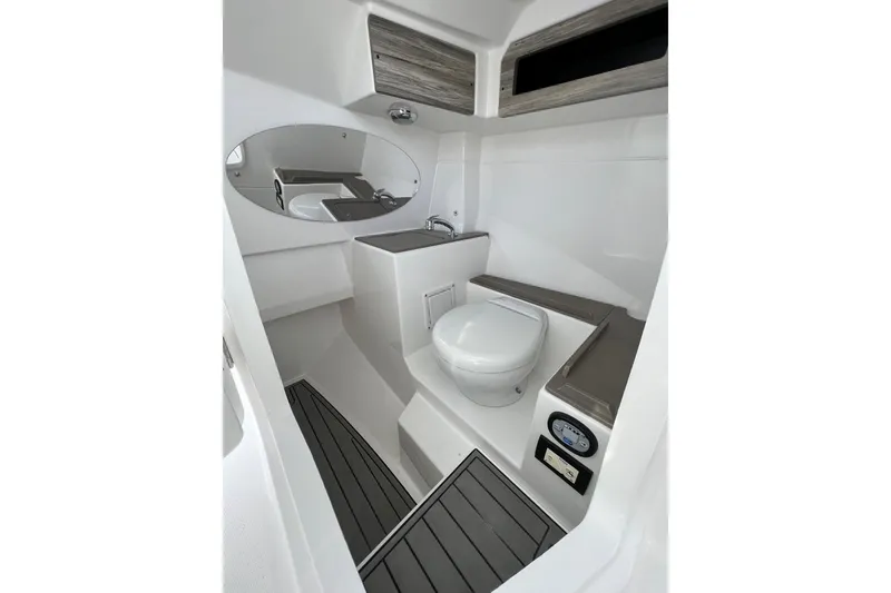 Slide: The Image of 2023 Edgewater 262CX Crossover boat interior with modern bathroom amenities. - 7