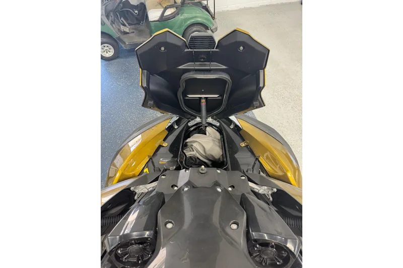 Slide: The Image of 2023 Kawasaki Ultra LX jet ski with open storage compartment in a garage setting. - 18