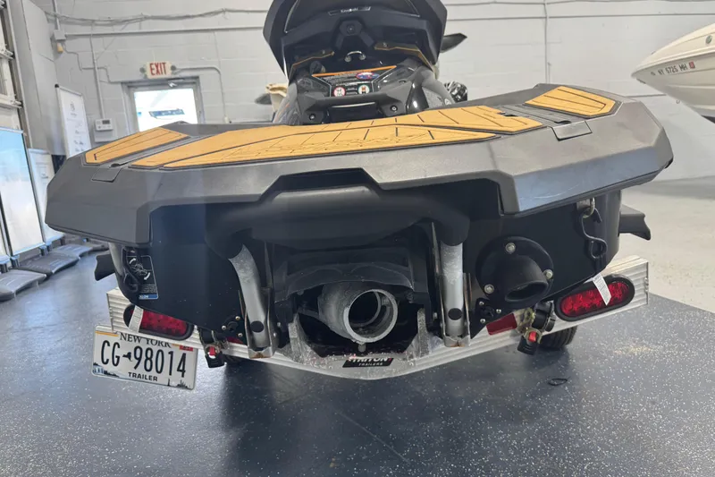 Slide: The Image of 2023 Kawasaki Ultra LX jet ski rear view in a garage setting. - 22