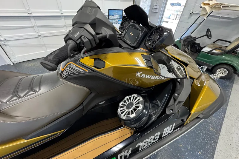 Slide: The Image of 2023 Kawasaki Ultra LX jet ski in a garage, featuring sleek design and advanced controls. - 6
