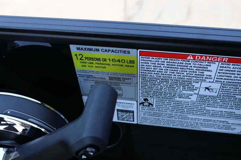 Slide: The Image of Warning labels on 2025 SunChaser Geneva Sport 23 LR PSB boat, showing capacity and safety instructions. - 10