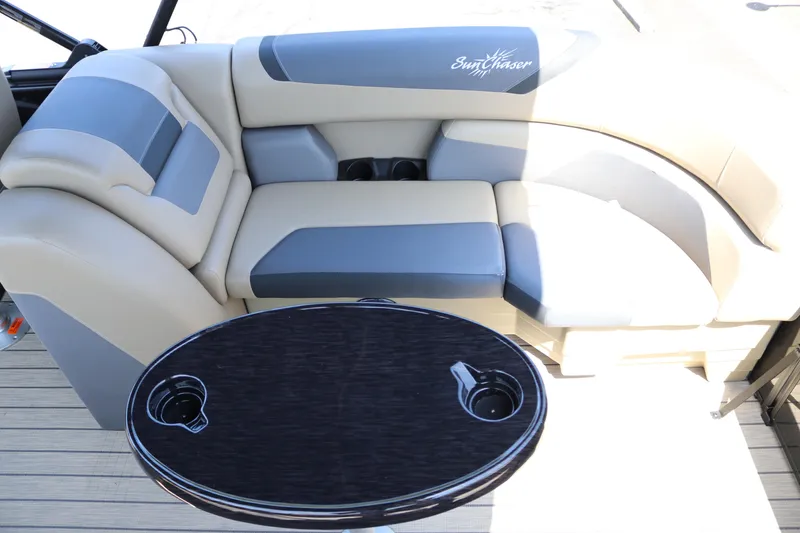 Slide: The Image of Luxurious seating and table on 2025 SunChaser Geneva Sport 23 LR PSB pontoon boat. - 23