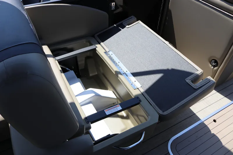 Slide: The Image of Open storage compartment in 2025 SunChaser Geneva Sport 23 LR PSB boat interior. - 25