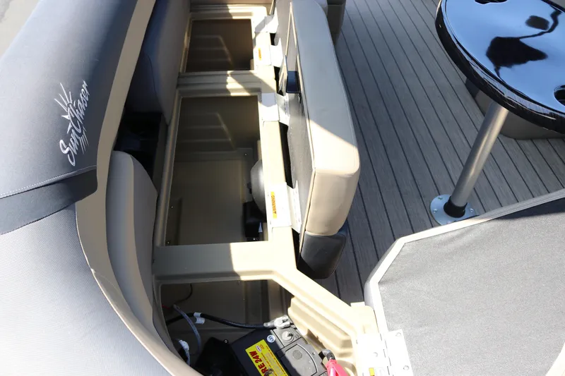 Slide: The Image of Interior view of 2025 SunChaser Geneva Sport 23 LR PSB boat with seating and storage compartments. - 30