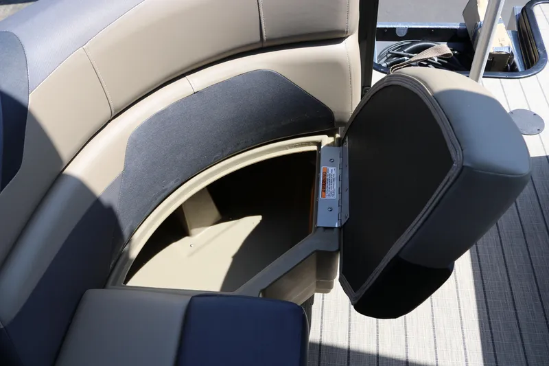 Slide: The Image of SunChaser Geneva Sport 23 LR PSB 2025 boat seat with open storage compartment. - 38