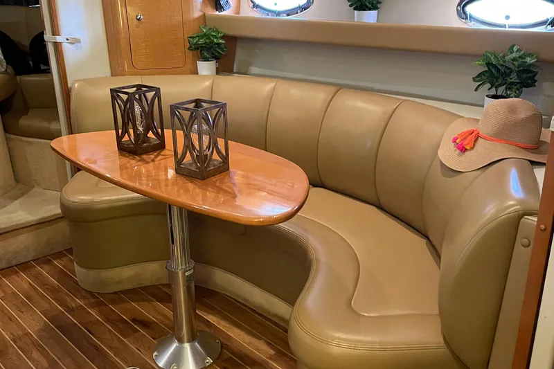 Slide: The Image of Luxurious interior of 2006 Chaparral Signature 350 yacht with leather seating and wooden table. - 10