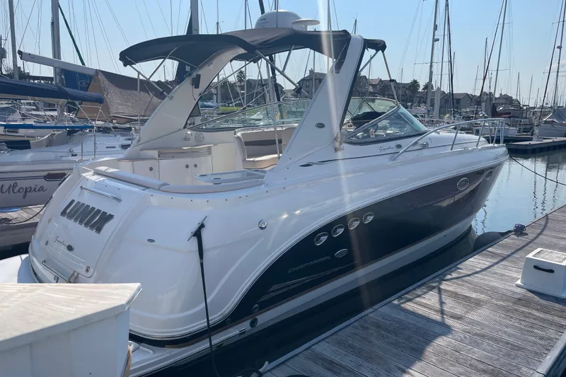 Slide: The Image of 2006 Chaparral Signature 350 yacht docked at marina, side view. - 2