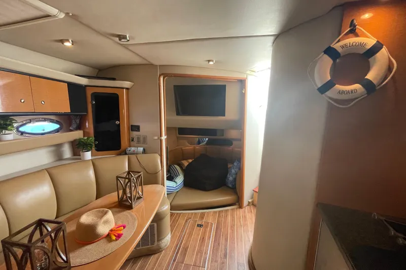 Slide: The Image of Interior of 2006 Chaparral Signature 350 yacht with cozy seating and nautical decor. - 20