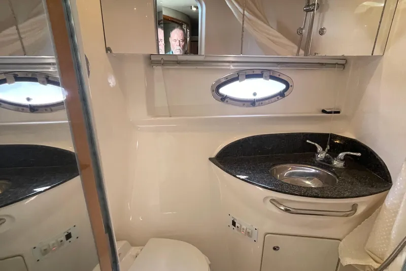 Slide: The Image of Bathroom interior of 2006 Chaparral Signature 350 yacht with sink and porthole window. - 21