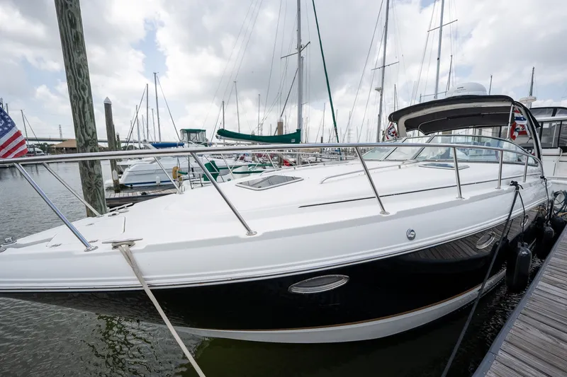 Slide: The Image of 2006 Chaparral Signature 350 yacht docked at marina under cloudy sky. - 3