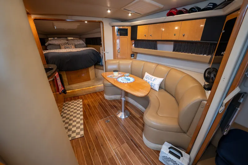 Slide: The Image of Interior of 2006 Chaparral Signature 350 yacht with cozy seating and elegant wood finishes. - 10