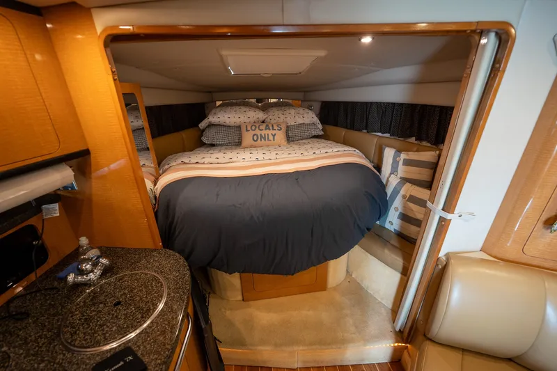 Slide: The Image of Interior of 2006 Chaparral Signature 350 yacht with cozy bed and stylish decor. - 13