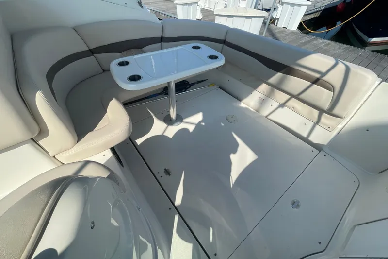 Slide: The Image of 2006 Chaparral Signature 350 boat interior with seating and table on deck. - 8