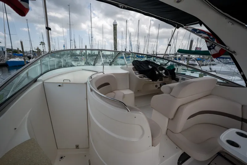 Slide: The Image of 2006 Chaparral Signature 350 boat interior with plush seating at marina. - 6