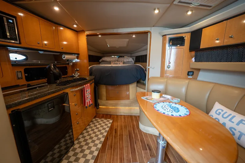 Slide: The Image of Luxurious interior of 2006 Chaparral Signature 350 yacht with kitchen and cozy sleeping area. - 11