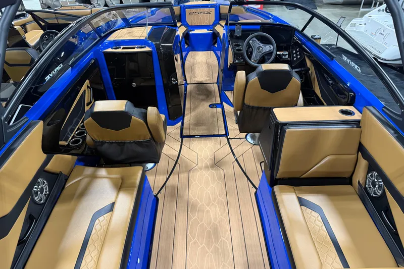 Slide: The Image of Interior of 2026 Yamaha Boats 255XD, featuring luxurious tan and black seating. - 3