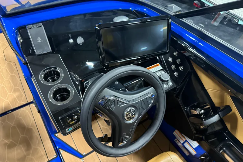 Slide: The Image of Interior view of 2026 Yamaha Boats 255XD dashboard with steering wheel and touchscreen display. - 5