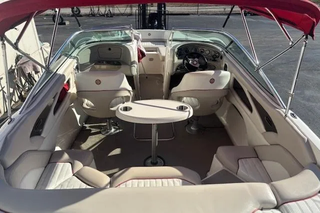 Slide: The Image of Interior of a 2006 Bryant 219 boat with seating and table. - 5