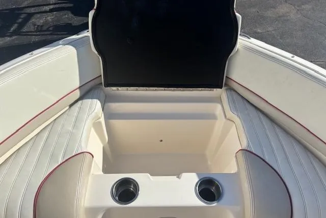 Slide: The Image of Interior of a 2006 Bryant 219 boat with seating and cup holders. - 9