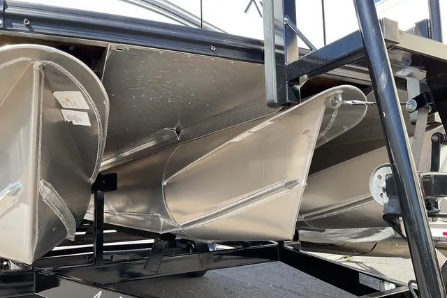 Slide: The Image of Underneath view of 2025 Avalon LSZ QUAD LOUNGE pontoon boat on trailer. - 10