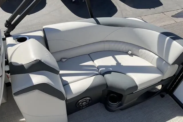 Slide: The Image of 2025 Avalon LSZ QUAD LOUNGE boat seating with cup holders and speaker. - 6
