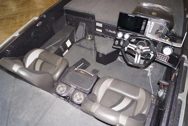 Slide: The Image of 2020 Bass Cat Lynx boat interior with dual seats and advanced dashboard controls. - 12