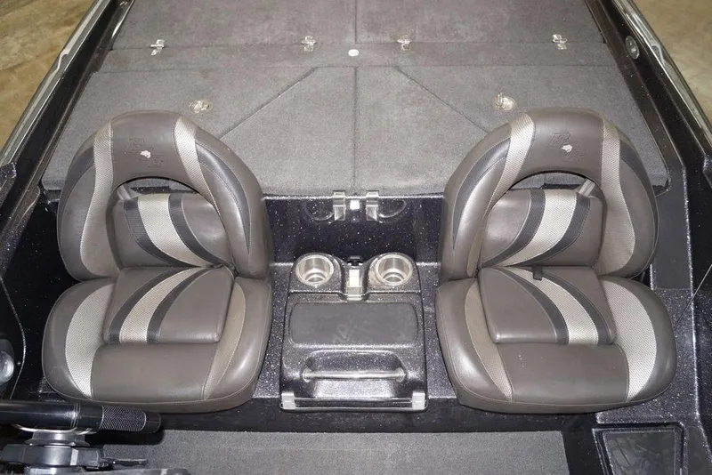 Slide: The Image of 2020 Bass Cat Lynx boat interior with dual seats and cup holders. - 14