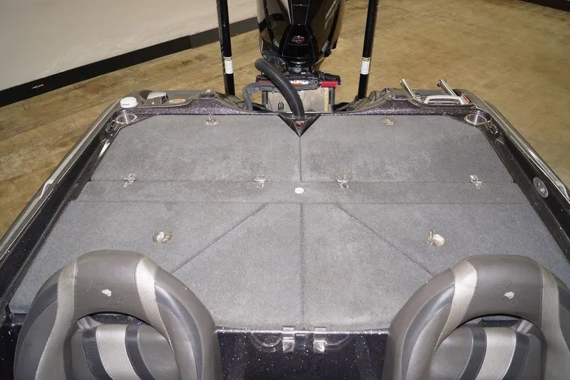 Slide: The Image of 2020 Bass Cat Lynx boat interior with gray carpet and dual seats. - 15