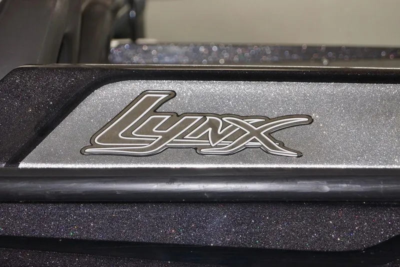 Slide: The Image of 2020 Bass Cat Lynx logo on a metallic surface. - 2
