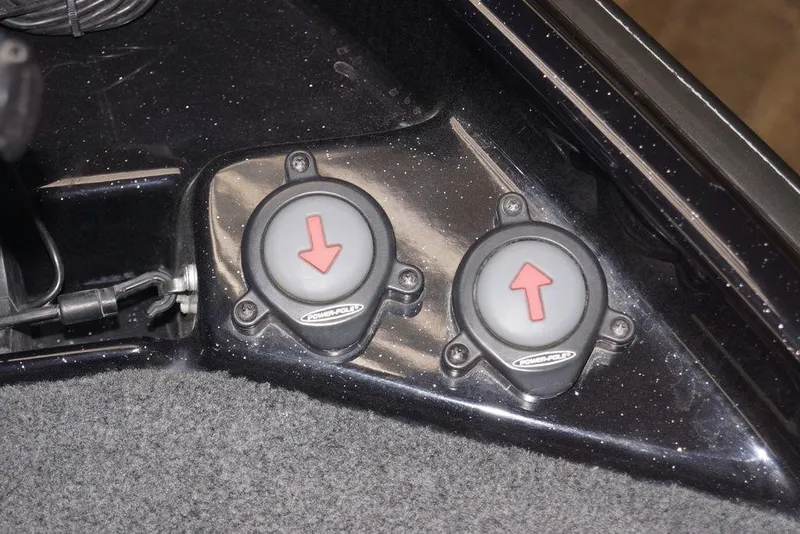 Slide: The Image of Power-Pole foot switches in a 2020 Bass Cat Lynx boat interior. - 25