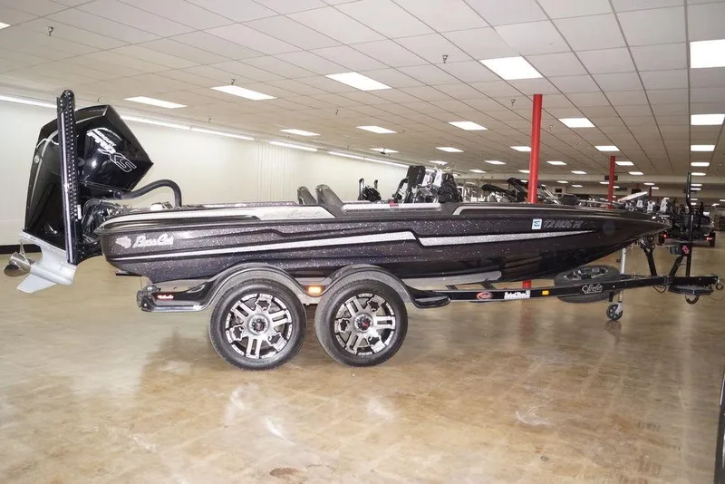 Slide: The Image of 2020 Bass Cat Lynx boat on display in showroom with trailer. - 4