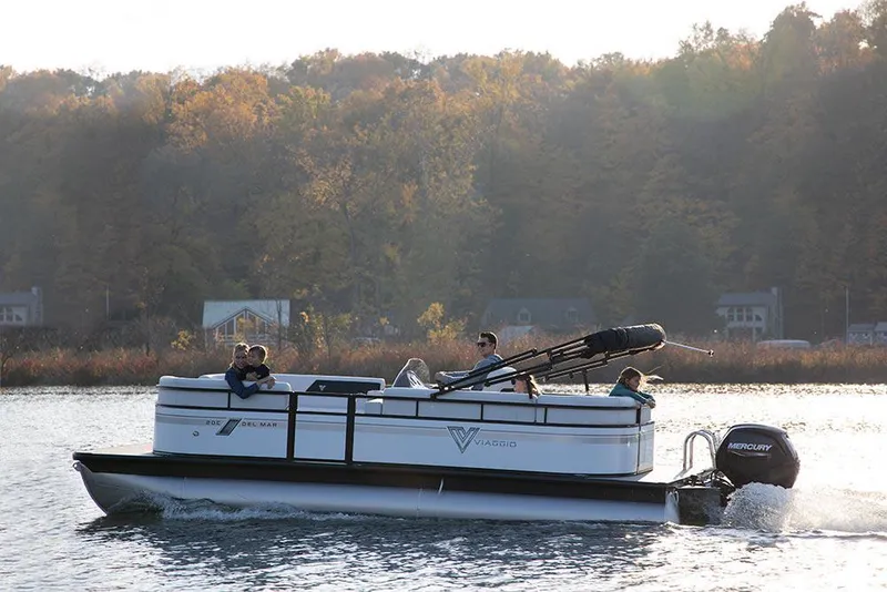Slide: The Image of Manufacturer Provided Image: 2023 Viaggio Del Mar F boat cruising on a serene lake with autumn foliage. - 14