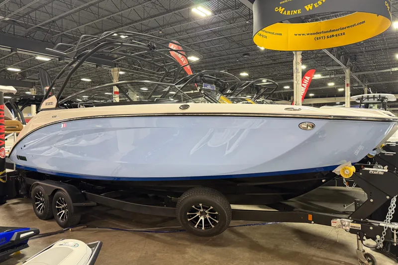 Slide: The Image of 2026 Yamaha Boats 252SD displayed indoors on a trailer. - 1
