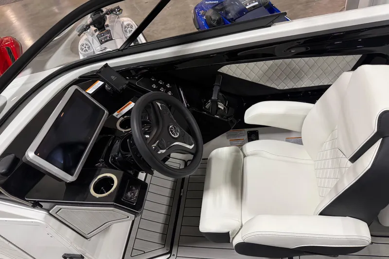 Slide: The Image of Interior of 2026 Yamaha Boats 252SD, featuring sleek dashboard and luxurious white seating. - 3