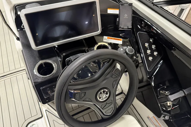 Slide: The Image of 2026 Yamaha Boats 252SD dashboard with steering wheel, touchscreen, and controls. - 4