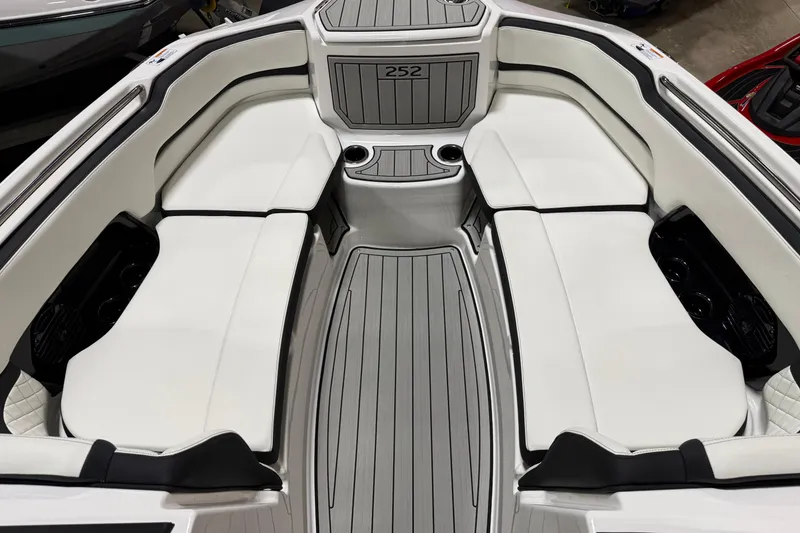 Slide: The Image of 2026 Yamaha Boats 252SD interior with white seating and sleek design. - 6