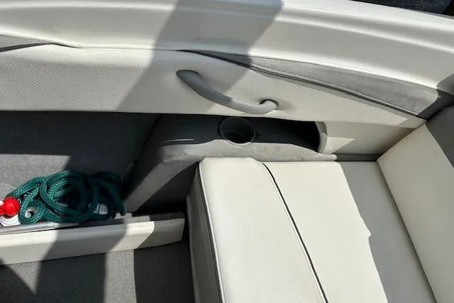 Slide: The Image of Interior of 2011 Bayliner 185 boat with seating and storage area. - 14