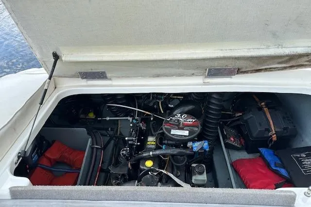 Slide: The Image of Engine compartment of a 2011 Bayliner 185 boat with visible components and accessories. - 6