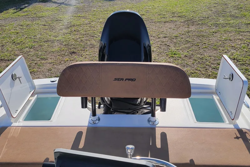 Slide: The Image of 2024 Sea Pro 172 Bay boat interior with seating and storage compartments. - 4
