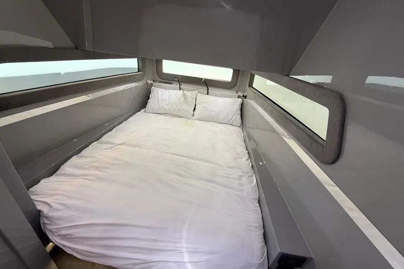 Slide: The Image of Cockpit of 2025 Midnight Express 52 Vitesse yacht with advanced navigation system at marina. - 11