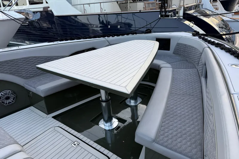 Slide: The Image of Luxurious seating area on a 2025 Midnight Express 52 Vitesse yacht. - 14